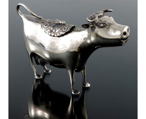 A Dutch silver cow creamer, in the form of a standing cow, early 20th century, pseudo mark, 14.5cm long, 4.33ozt