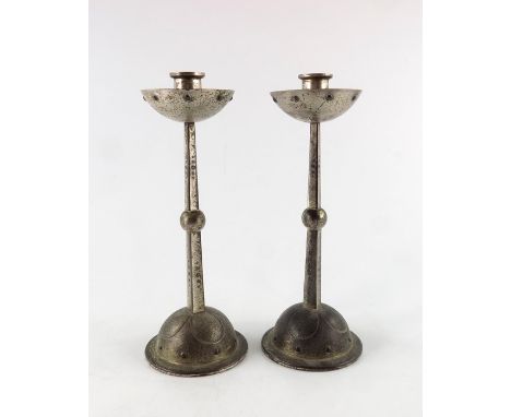 WMF, a pair of Jugendstil silver plated candlesticks, the ball knopped tapered square section stems suporting a hemispherical