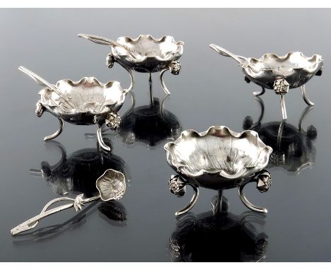 A set of four Chinese silver export salt cellars, Wang Hing, Hing Kong circa 1900, naturalistically modelled as flowers, on t