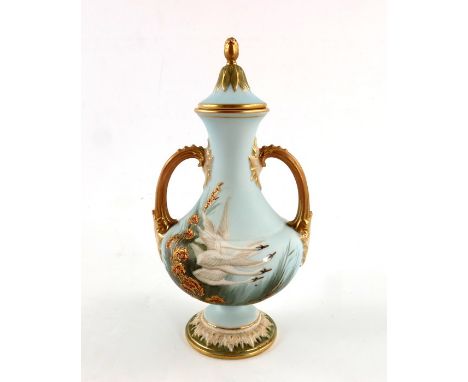 G Johnson for Royal Worcester, a swan painted twin handled vase and cover, 1912, ogee bulbous form, relief moulded foliate fo