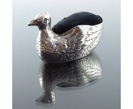 An early 20th century Continental silver novelty pin cushion, Hanau pseudo marks, circa 1900, modelled as a bird, 7.5cm long