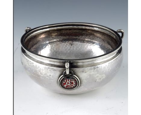 A E Jones, an Arts and Crafts silver and enamelled bowl, Birmingham 1936, ogee section, planished in the form of a Chinese ce