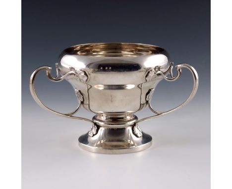 An Arts and Crafts silver three handled vase, Elkington and Co., Birmingham 1901, footed ogee form with open bisected whiplas