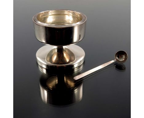 Robert Welch, a Modernist silver salt cellar and spoon, Birmingham 1973, cylindrical pedestal form with glass liner, 6.5cm hi