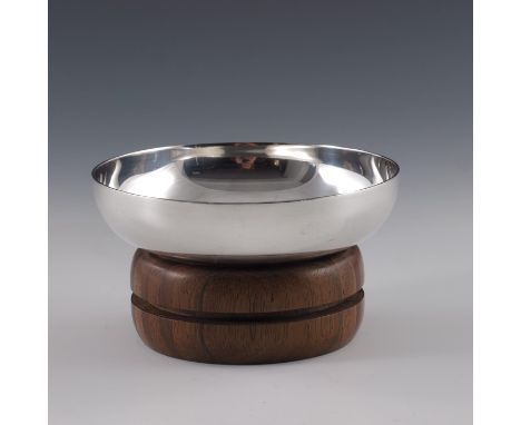 A Modernist silver and wooden bowl, DBF, Birmingham 1978, the concave dished ring supported on a turned mixed specimen wood s