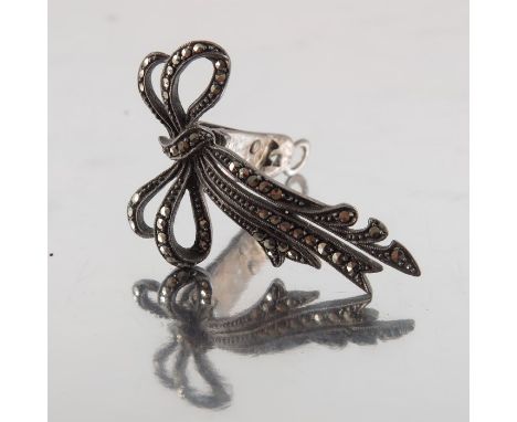 An Art Deco silver and marcasite clip, in the form of a bow, stamped marks, 4cm long