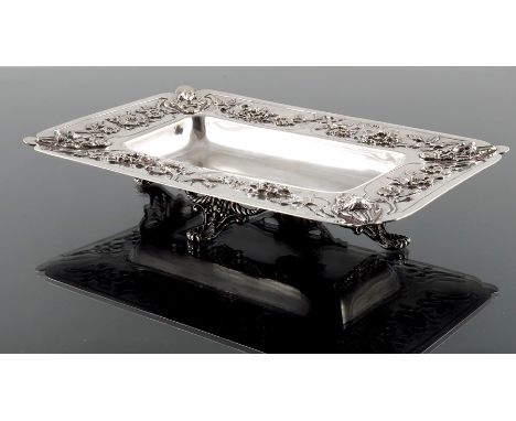 Latino Movio, an Arts and Crafts silver dish, Holland, Aldwinckle and Slater, London 1907, wide brimmed rectangular form, emb