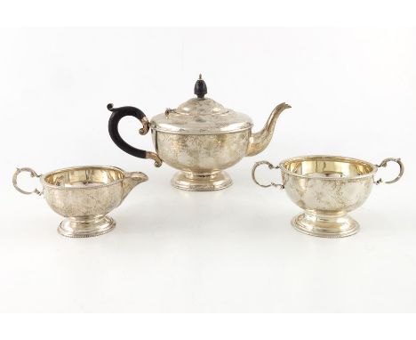 A George V silver three piece tea set, Marson and Jones, Birmingham 1931, pedestal bowl form on stepped bases with beaded rim