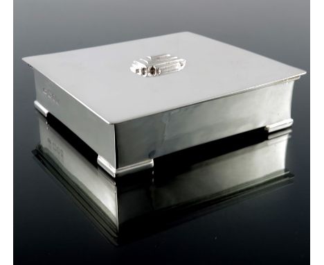 Charles Boyton, an Art Deco silver box, London 1928, planished cuboid form, on plain bracket feet, the hinged lid with geomet