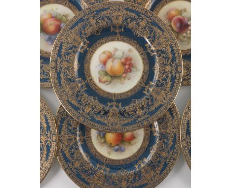R Sebright for Royal Worcester, a fruit painted part dessert service, 1917, C1331, each with a central roundel within powder 