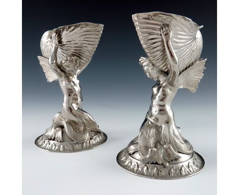 A pair of Victorian silver figural salt cellars and spoons, Smith, Nicholson and Co., London 1852, heavily cast as kneeling w