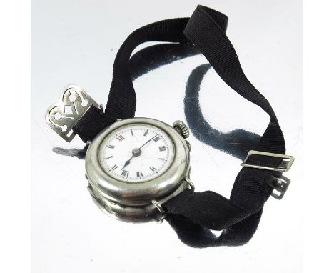 A ladies silver wristwatch, white enamelled dial, on black silk strap, 3cm