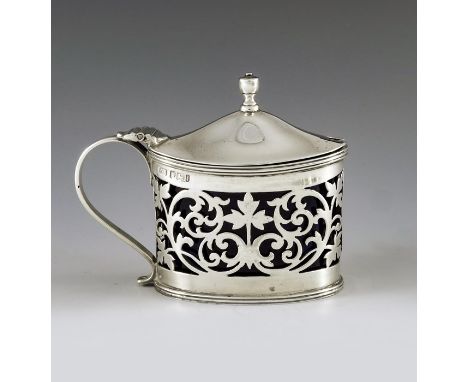 Henry Stafford, Sheffield 1901, an Edwardian silver mustard pot, straight sided oval form, reticulated foliate scroll design,
