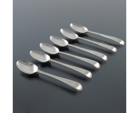 A set of six George III silver bright cut teaspoons, George Gray, London 1788, with tongue heels to the bowls, 12.5cm long, 3