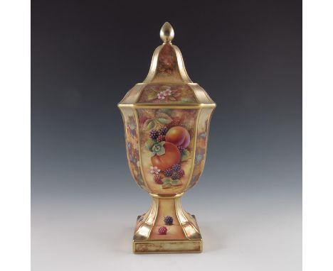 D Fuller for Royal Worcester, a fruit painted pedestal vase and cover, square section acorn form, each panel within fully gil