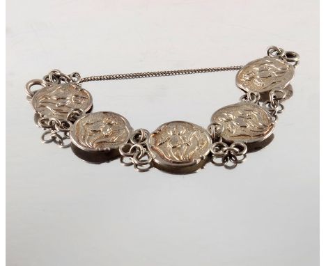 An Arts and Crafts silver button bracelet, Henry Matthews, Birmingham 1901, the five Art Nouveau style cast buttons with iris