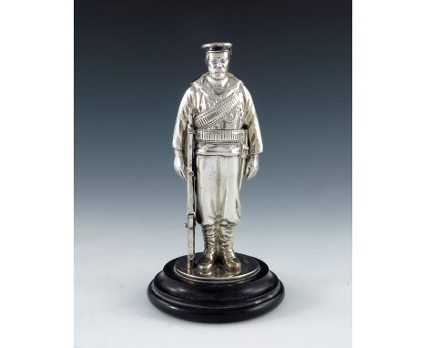 A Victorian novelty silver inkwell, Horace Woodward and Co., London 1898, realistically modelled as a soldier with enamelled 