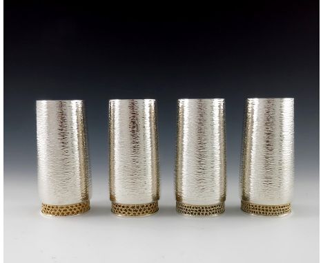 Stuart Devlin, two pairs of Modernist silver and parcel gilt beakers, London 1978 and 1980, each of planished rounded cylindr