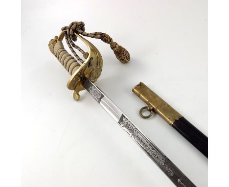 A George VI Naval Officer's dress sword, housed in leather scabbard with brass mounts and two hanging strap rings, shagreen a