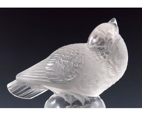 Rene Lalique, a Chardonneret Moqueur (bird) glass paperweight, model 1211, designed circa 1931, a model of a bird head up, et