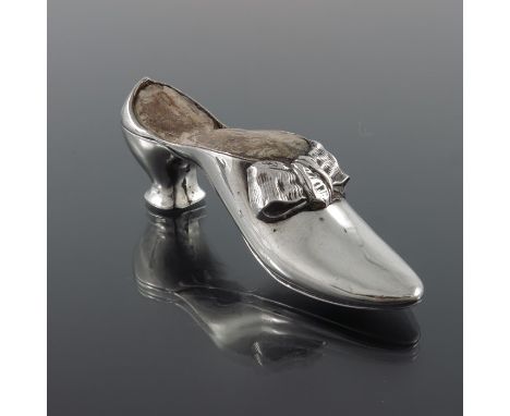 A George V novelty silver pin cushion, Adie and Lovekin Ltd., Chester 1922, modelled as a shoe, with bow, 11cm long