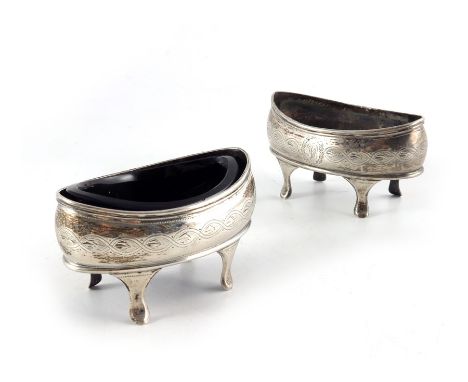 A pair of George III silver salt cellars, Solomon Hougham, London 1801, navette boat form, bright cut with feathered husks in