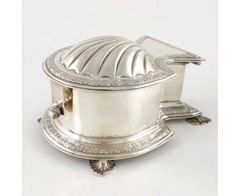 An Edwardian silver ink casket, Carrington and Co., London 1903, shell form with relief moulded domed scallop lid, the border