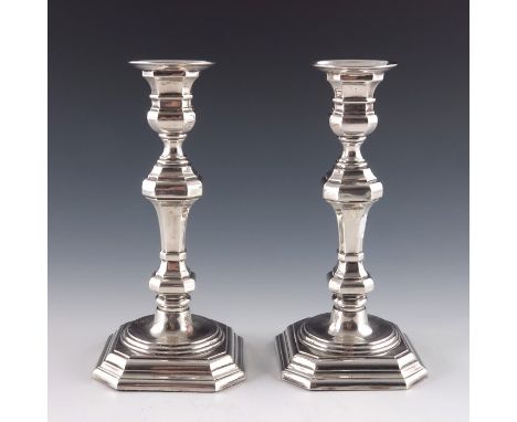 A pair of Spanish silver candlesticks, in the 18th century style, octagonal section knopped baluster form, weighted, stamped 