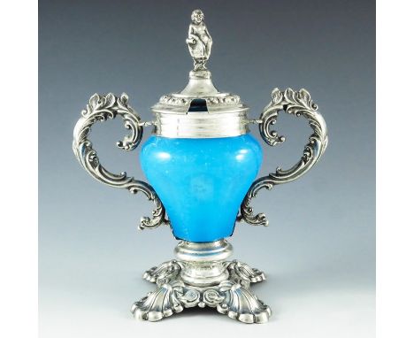 A P, Vienna 1854, a 19th century Austrian silver and glass mustard pot, the pear shaped slice cut blue opaque vessel, mounted