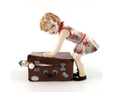 Stephan Dakon for Goldscheider, an Art Deco Austrian figure of a girl packing a suitcase, 7779, circa 1937, incised and stamp