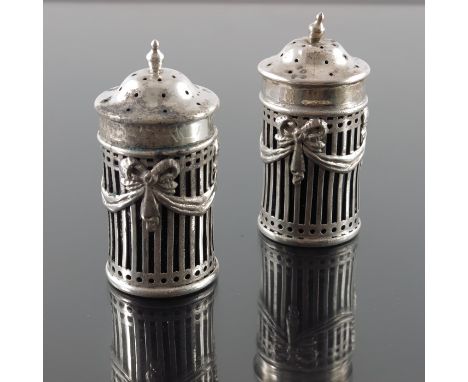 A pair of Edwardian silver salt and pepper shakers, William Hutton and Sons, London 1905, reticulated cylindrical form with N