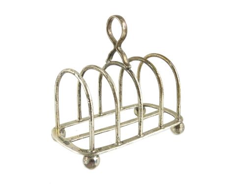 A George V silver four division toast rack, Goldsmiths and Silversmiths Company, Sheffield 1931, rounded arch form on four ba