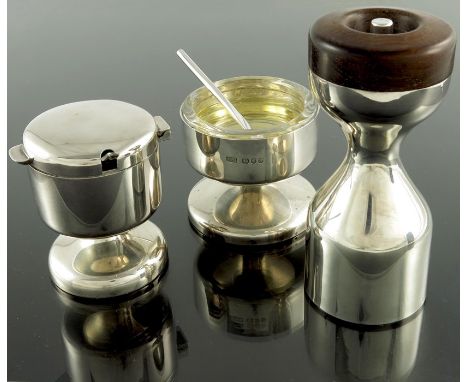 Robert Welch, a Modernist silver three piece cruet, London 1976, waisted hourglass form, the grinder with hardwood top, the s