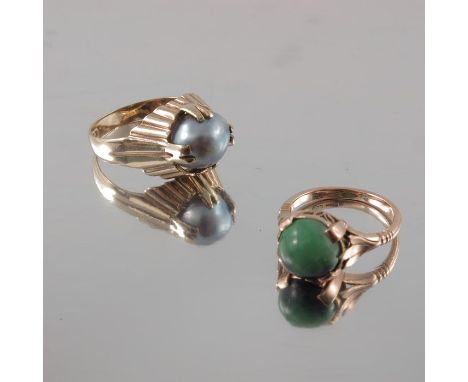 A Chinese gold and jade ring, together with a grey pearl ring, approx. size U and K (2)