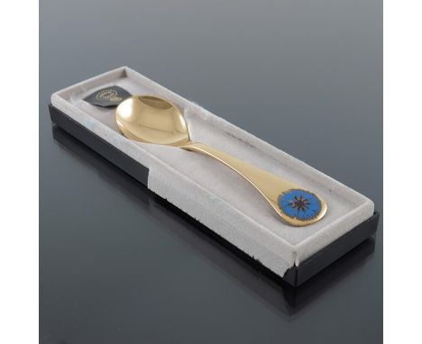 Georg Jensen, a Modernist silver gilt and enamelled year spoon, Denmark 1972, with blue enamel cornflower, 15cm long, 1.44ozt