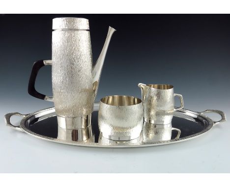 Christopher Lawrence for Asprey and Co., a Modernist silver four piece coffee set, London , including coffee pot, jug, bowl a