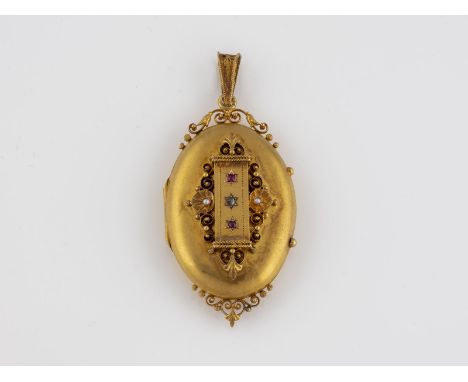 MEDAILLON Gelbgold. 7 x 3,2 cm, Ges.-Gew. ca. 19,8 g. Geprüft mindestens 14 K. Eine Diamantrose, zwei rund facettierte Rubine
