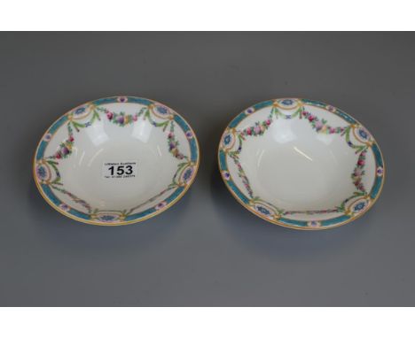 Pair of Royal Worcester early 20C dishes decorated with Polychrome floral swags