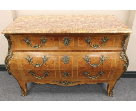 A French ormolu mounted three drawer bombe commode, with rouge marble top, width 124 cm. CONDITION REPORT: Good condition.