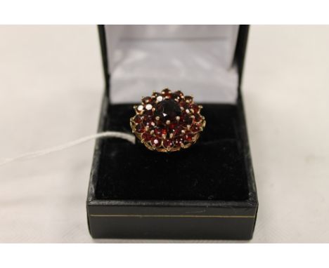 A 9ct gold garnet cluster ring. CONDITION REPORT: Good condition.