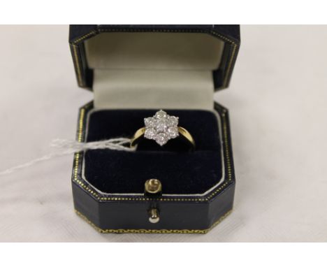 An 18ct gold diamond cluster ring. CONDITION REPORT: Good condition.