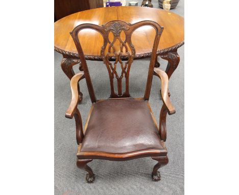 A Victorian mahogany extending dining table on claw and ball feet, width 106 cm, together with a set of six Chippendale style