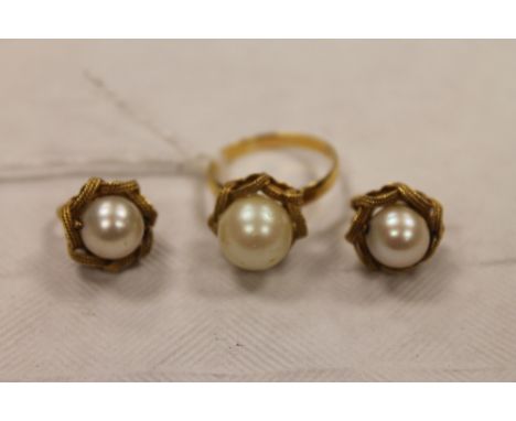 A pair of continental yellow metal pearl earrings, together with the matching dress ring. (3) CONDITION REPORT: Numerous indi