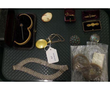 A yellow metal filigree bangle, together with yellow metal locket, two 9ct gold bar brooches, lock of hair etc. (Q)