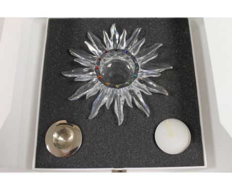 A Swarovski silver crystal figure - Sunburst candle light, boxed.