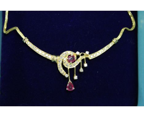 A 22ct gold ruby and diamond necklace.