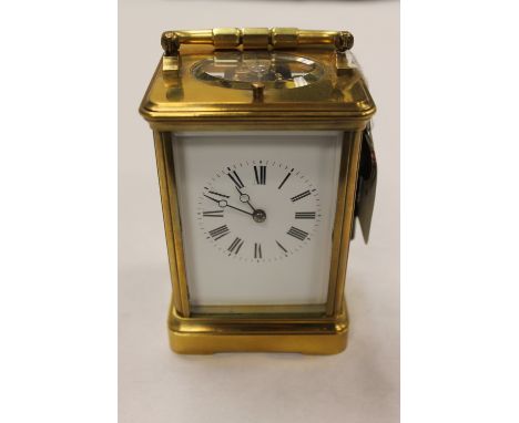 A brass striking carriage clock, height 13 cm. CONDITION REPORT: Good condition, ticking away, striking upon a gong.