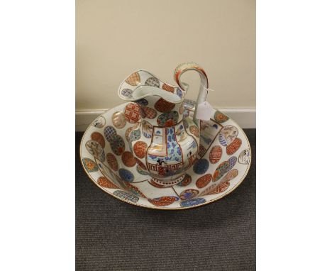 A nineteenth century Japanese water jug and basin, together with a lidded chamber pot, vase and liddd long dish, six characte