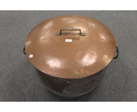 A French copper cooking pot with lid, diameter 60 cm. CONDITION REPORT: Very large item, small rim split but otherwise good a