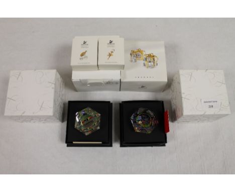 Two Swarovski crystal Arribas collection paperweights, together with three Crystal Memories accessories and alarm clock with 